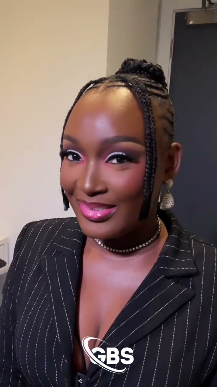 The same client after her GBS glam: pink and white eyeshadow, glowing skin and a glossy pink lip